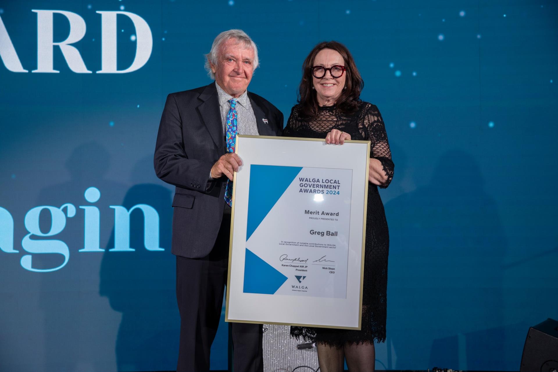 WALGA President, Cr Karen Chappel presents Cr Greg Ball with Merit Award at the 2024 WALGA Awards in recognition of notable contributions to WALGA, Local Government and the Local Government sector.